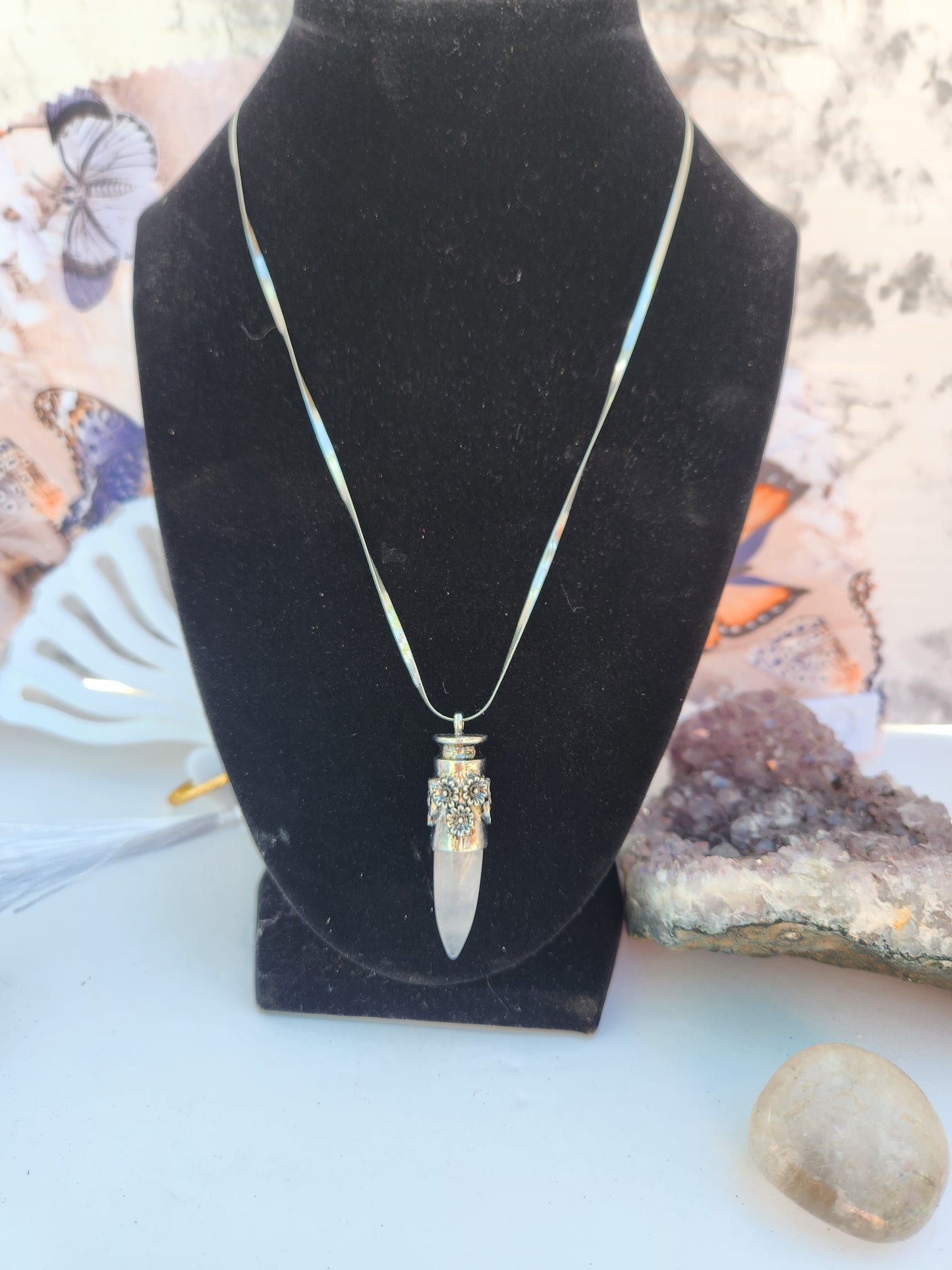 Crystal clear flower dagger pendant