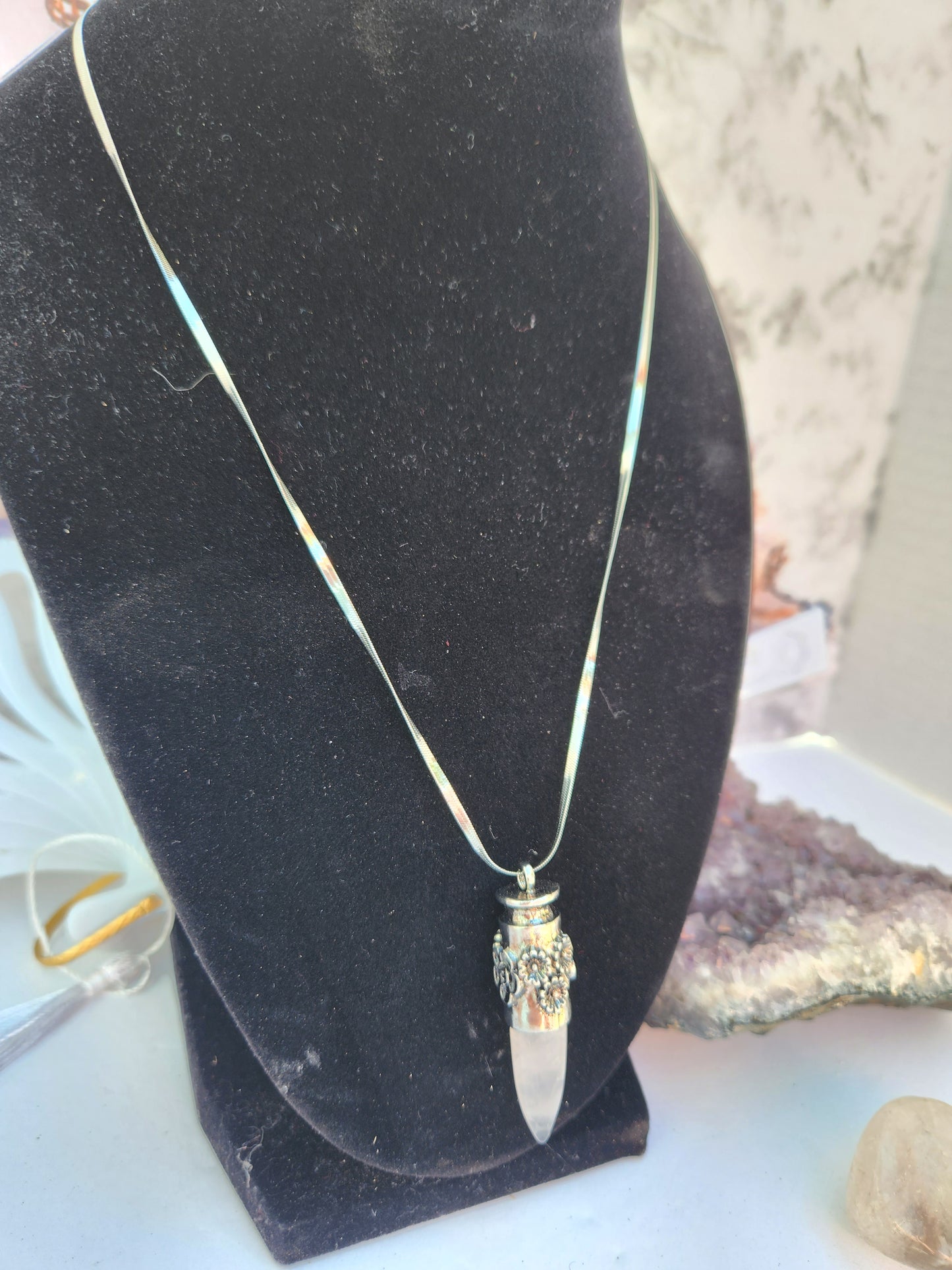 Crystal clear flower dagger pendant
