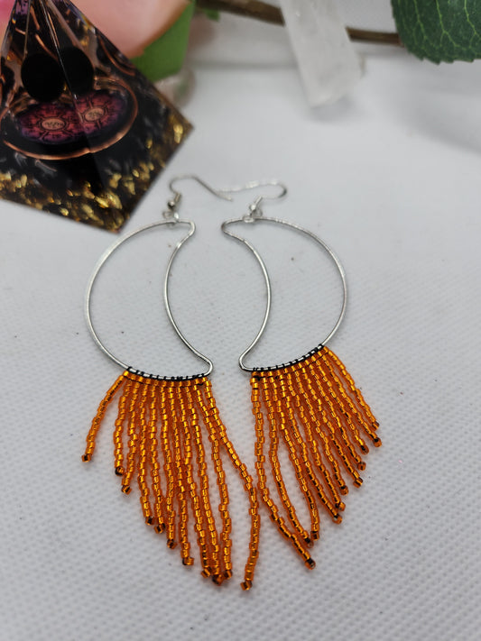 Orange fringe moon earrings